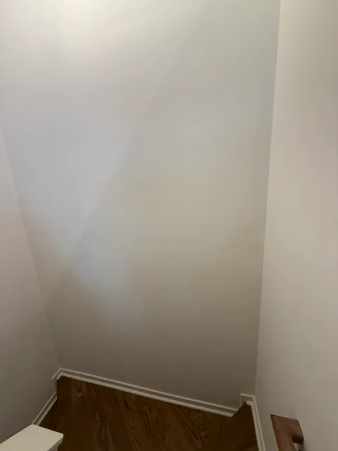 Same stair wall after repair and repainting in South End