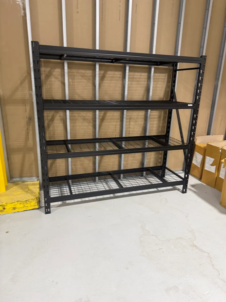Ironton 4-tier industrial shelving rack assembled in a Charlotte garage