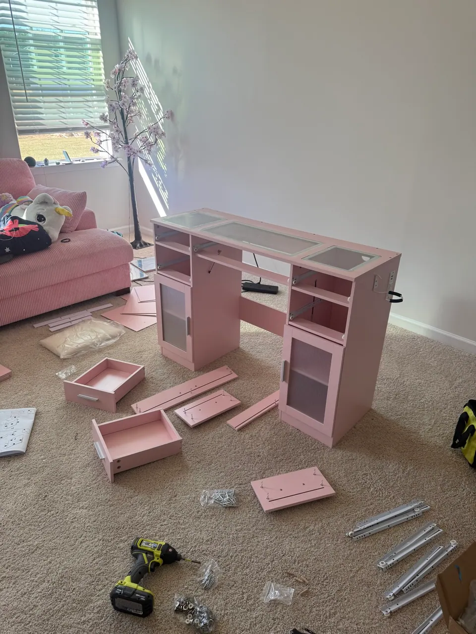 Pink vanity assembly in progress with Ryobi tools