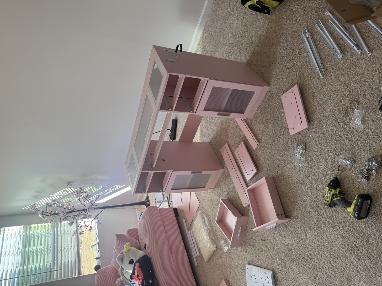 Pink vanity assembly in progress with Ryobi tools