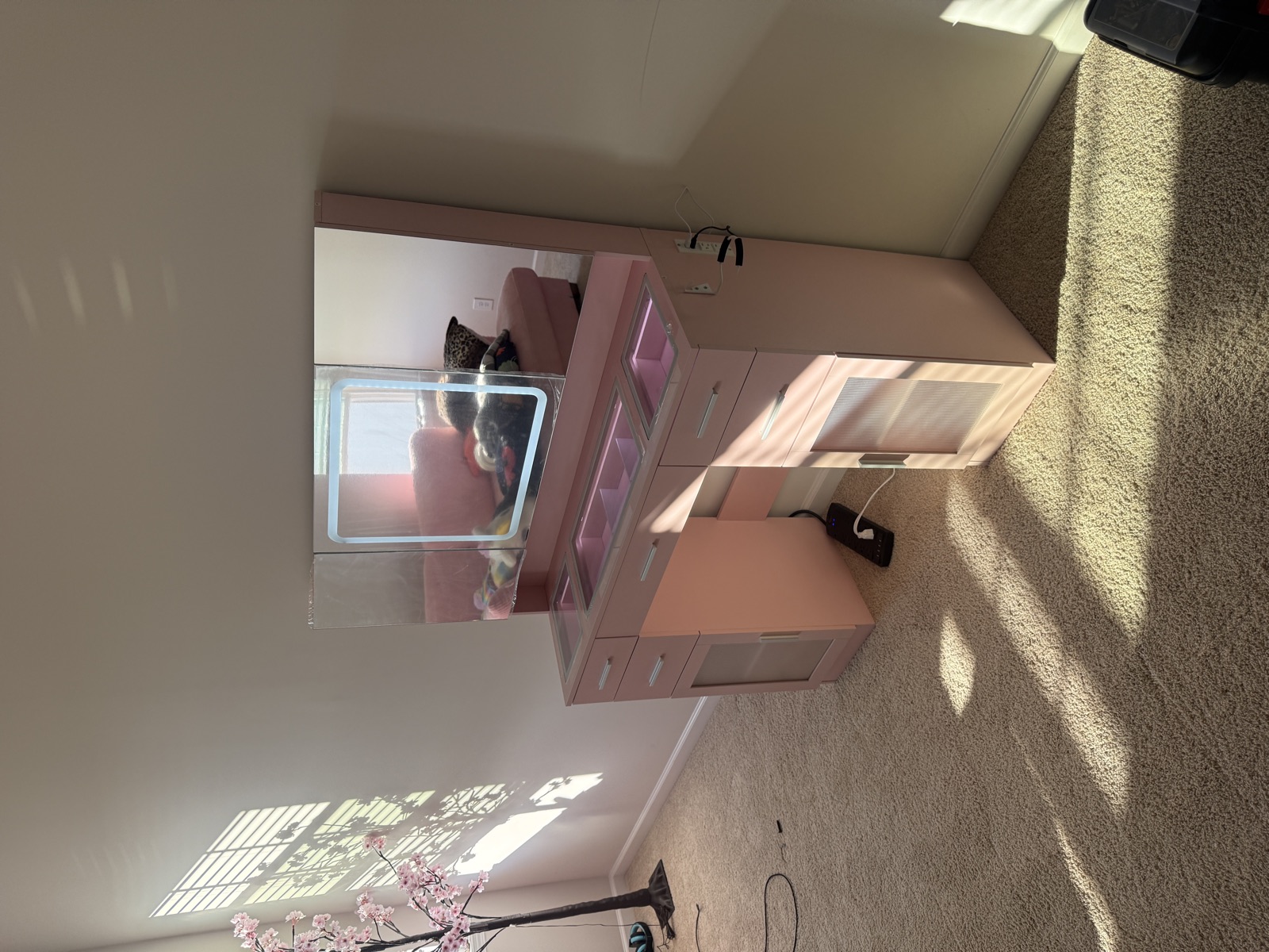 Pink vanity with LED tri-fold mirror assembled for a kid bedroom in Charlotte
