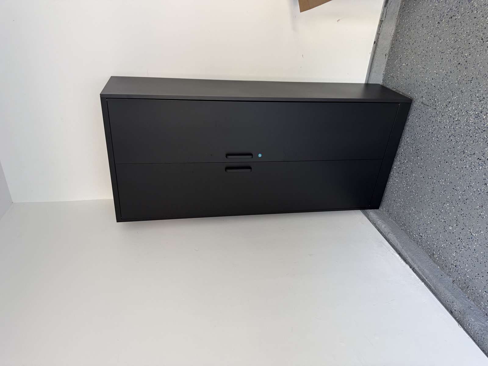 Heavy-duty black steel storage cabinet assembled by FixCraft VP
