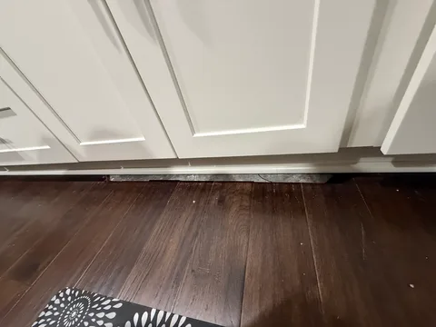 Another angle of the exposed floor strip before repair